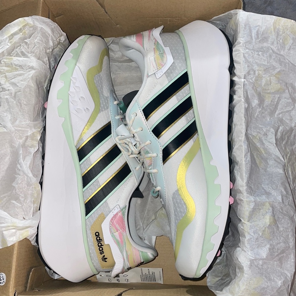 adidas Women's Sneakers in White, Black, and Gold